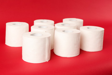 Rolls of toilet paper on color background