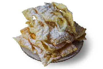 Angel wings are pastry made of dough, thin twisted ribbons, deep fried and sprinkled with powdered sugar .Europe .Isolated photo on white background.