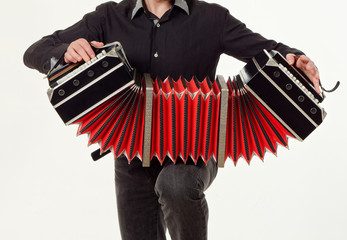 GOMEL, BELARUS - FEBRUARY 14, 2019: a bandoneon musical instrument in the hands of a musician.