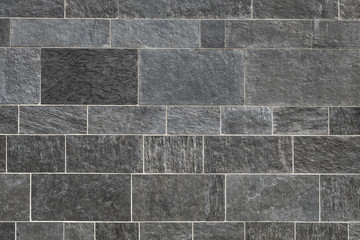 Black stone wall background, High quality gray stone paving with light mortar