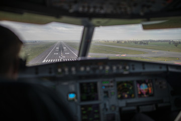 Pilot's hand accelerating on the throttle in  a commercial airliner airplane flight cockpit during...