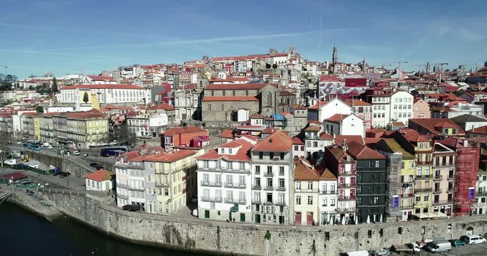 Drone shot of Douro River shore, in Porto, Portugal, with its many traditional houses.
