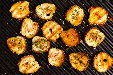 Slices of bread on a grill for making bruschetta