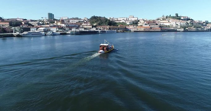 Aerial shot of a boat in Douro River.