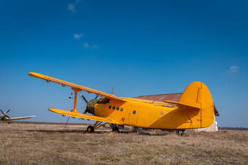Fototapeta na wymiar A big old yellow plane