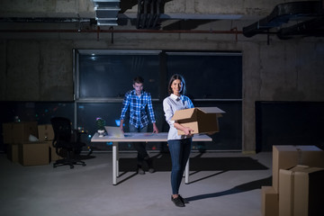 business people on construction site  in new startup office at night