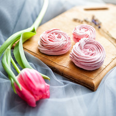 pink marshmallow on Board with flowers