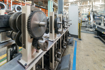Roller forming machine. The interior of the plant producing a metal profile.