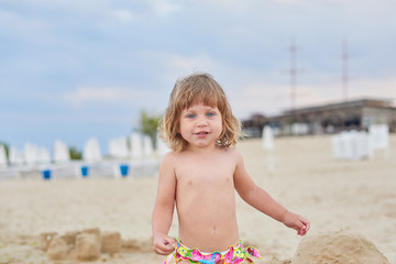 Happy girl enjoying sunny day at the beach.