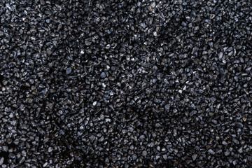 A lot of black rock on the ground