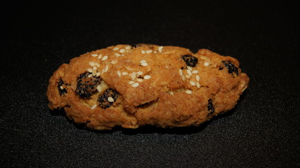 Bun with raisins and sesame