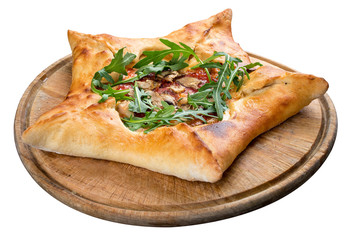 Star-shaped pizza with ham and arugula on a wooden board. On white background