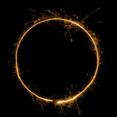 Sparkler circle shape frame. Burning bengal fire round letter o number zero, long exposure. Burning...