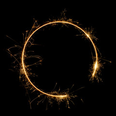 Burning bengal fire sparkler round letter o number zero, long exposure. Burning sparklers isolated...