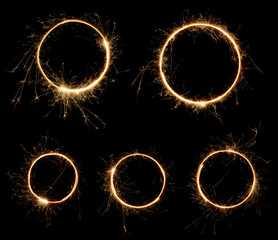 Sparklers rings isolated on black. Set of burning bengal fire long exposure circles.