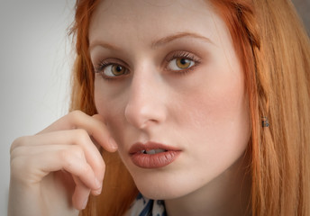 Close-up of a beautiful girl with red hair