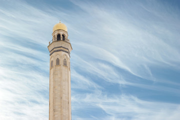 Mosque, minarets against a beautiful blue sky on a sunny day