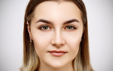 Naklejka premium Front view on beautiful female face with perfect skin.