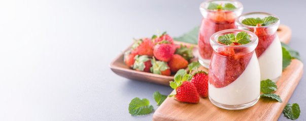 Delicous and nutritious double color (colour) strawberry desserts with mint and diced sarcocarp...