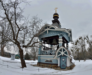 Wooden Belfry of Holy Trinity monastery of Saint Jonah with beautiful carving, located in botanical garden of Hryshko,Kiev Ukraine