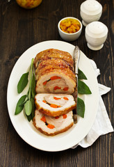 Fried pork loin stuffed with carrots and garlic. Festive dish.