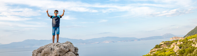 Young boy traveling along the coast of the Mediterranean Sea.