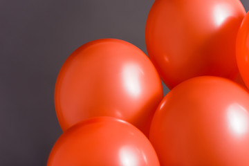 coral air balloons on grey background, color of 2019 concept