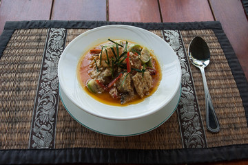 Spicy Thai soup with fish, seafood and vegetables.