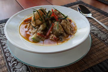 Spicy Thai soup with fish, seafood and vegetables.