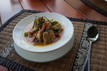 Spicy Thai soup with fish, seafood and vegetables.