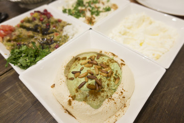 Food, oriental,  appetizers, salad, hummus, avocado, pine nuts, tasty, gourmet, restaurant, traditional, cuisine, dish, dinner, close-up, mix, healthy, Lebanese, Arabic, UAE, table, middle east, menu,