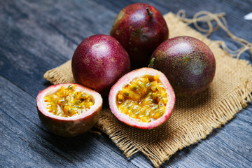 fresh passion fruit on dark wooden table