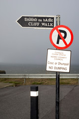 signs at the start of a cliff walk