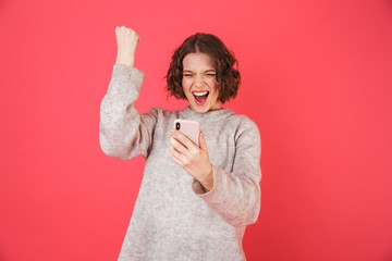 Portrait of a cheerful young woman standing