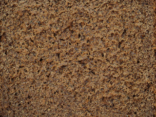 Rye bread with coriander texture, pulp crumb close-up baking dark background