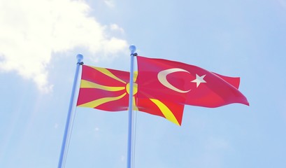 Macedonia and Turkey, two flags waving against blue sky. 3d image