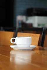Well mixed hot black coffee in white coffee cup with space for write wording served in a restaurant in a coffee break time, popular drink for meeting place and party time, value added design for bette