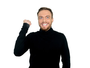 Fototapeta premium Cheerful handsome man opened mouth and squeeze fists, rejoices his triumph, was overjoyed expression, isolated on white background. People, success, body language concept