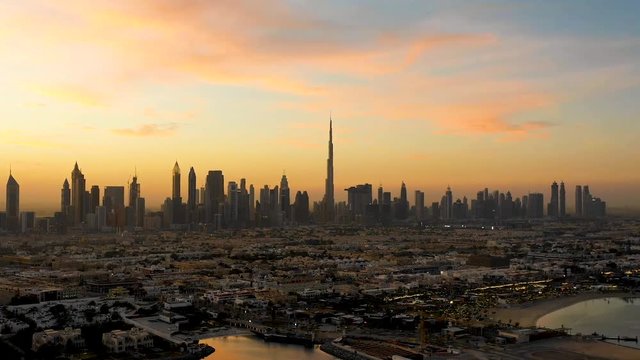 Aerial hyperlapse of Dubai skyscrapers during scenic sunset, Dubai, U.A.E.
