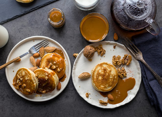 Breakfast with blini with caramel at black background