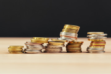 piles of coins on working table