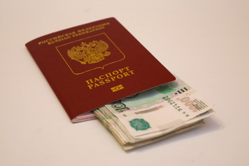 Russian passport and banknotes in denominations of 1 thousand rubles