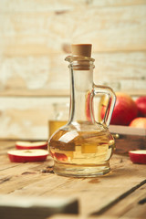 Obraz na płótnie Canvas Apple cider vinegar. Bottle of apple organic vinegar