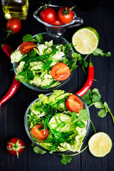 Fototapeta na wymiar fresh vegetable and green seaweed salad in a glass plate