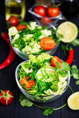 fresh vegetable and green seaweed salad in a glass plate