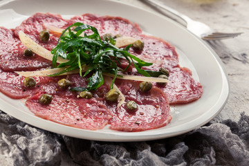 Beef carpaccio with arugula and parmesan
