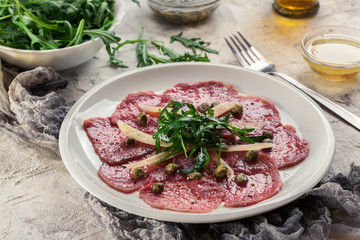 Beef carpaccio with arugula and parmesan
