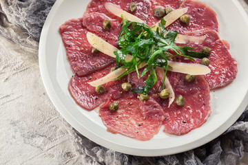 Beef carpaccio with arugula and parmesan