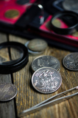 english old coin, numismatics on old wooden background