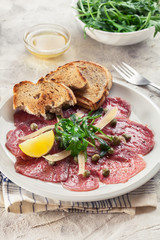 Beef carpaccio with arugula and parmesan